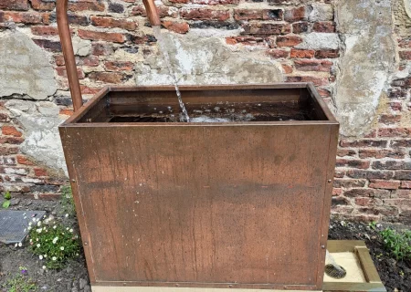 A wooden outdoor sink.